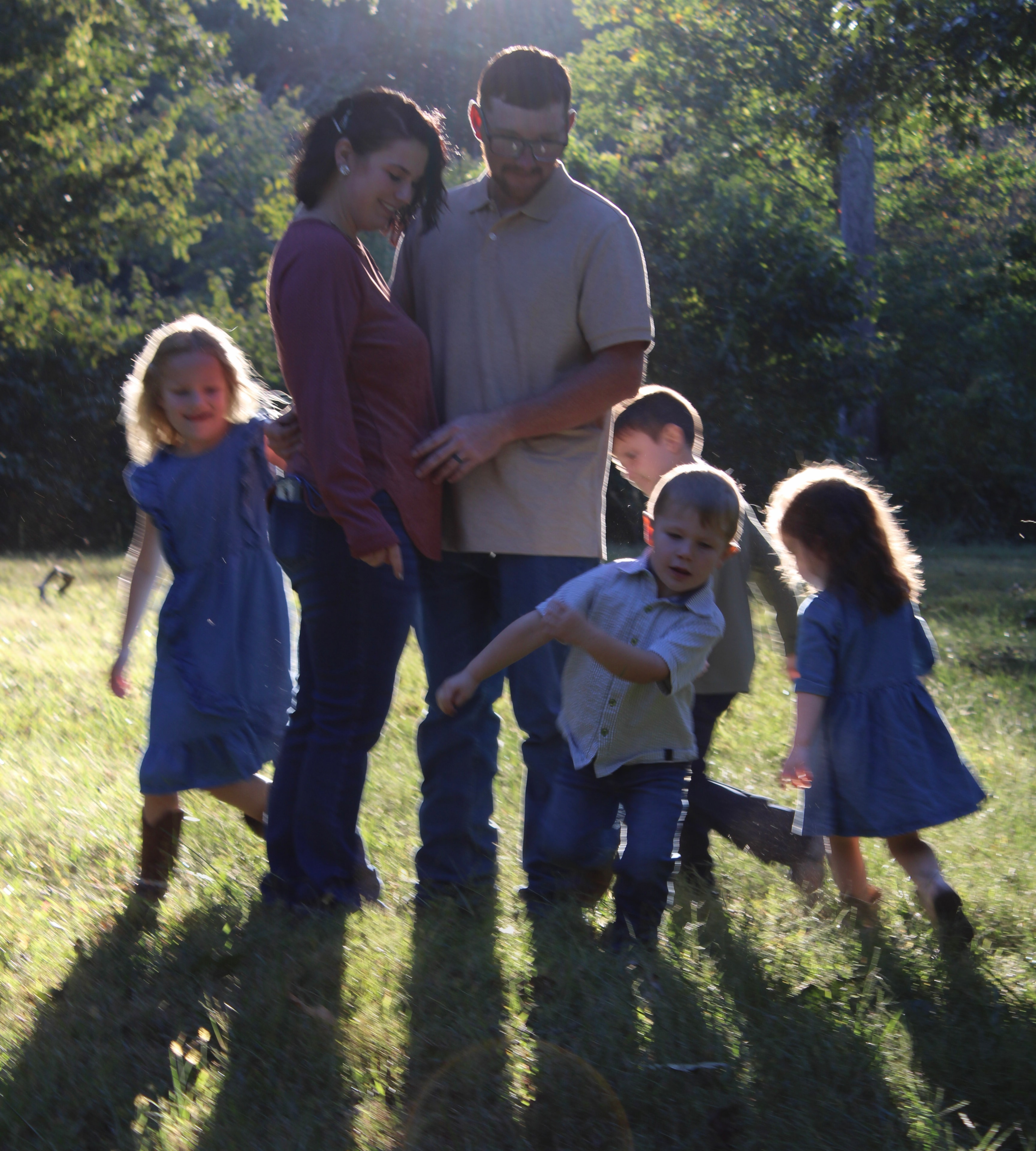 Family with four children playing outdoors